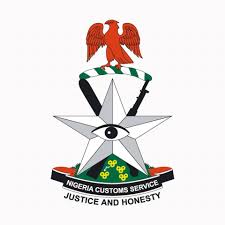 Nigeria Customs officers displaying seized petrol from smugglers during Operation Whirlwind
